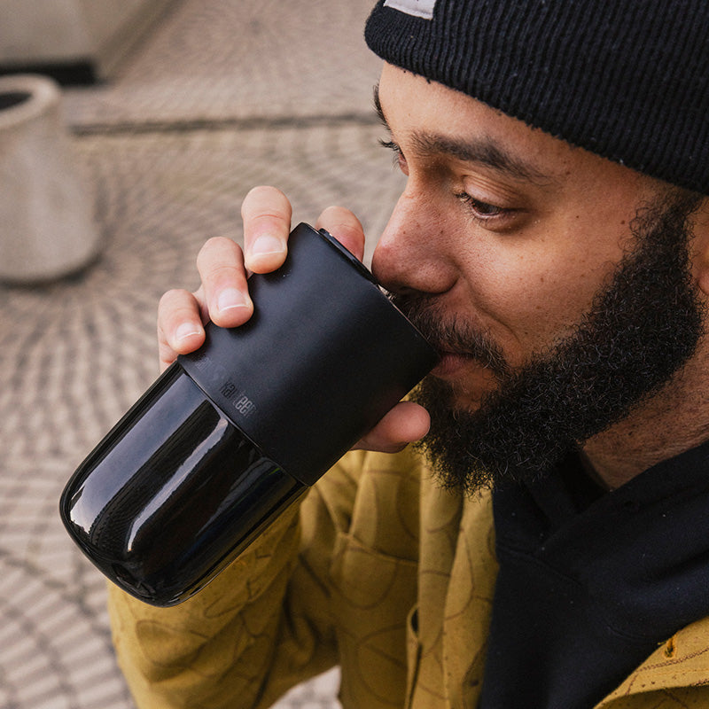 16oz-rise-tumbler-q7 16oz_rise_tumbler_black_man_drink_square.jpg