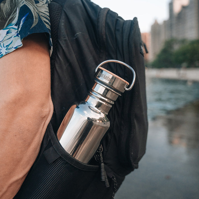 27oz-reflect-with-bamboo-cap-l2 K27SSLRF-MS-BAMBOO_reflect-bottle_backpack_lifestyle.jpg
